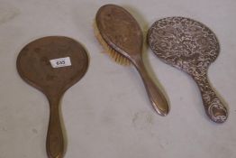 A hallmarked silver brush and two mirrors
