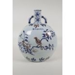 A Chinese Ming style blue, white and red porcelain moon flask with two handles, decorated with birds