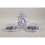 A Meissen onion pattern coffee pot and two cups and saucers, 6" high