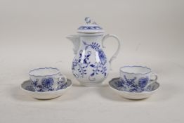 A Meissen onion pattern coffee pot and two cups and saucers, 6" high