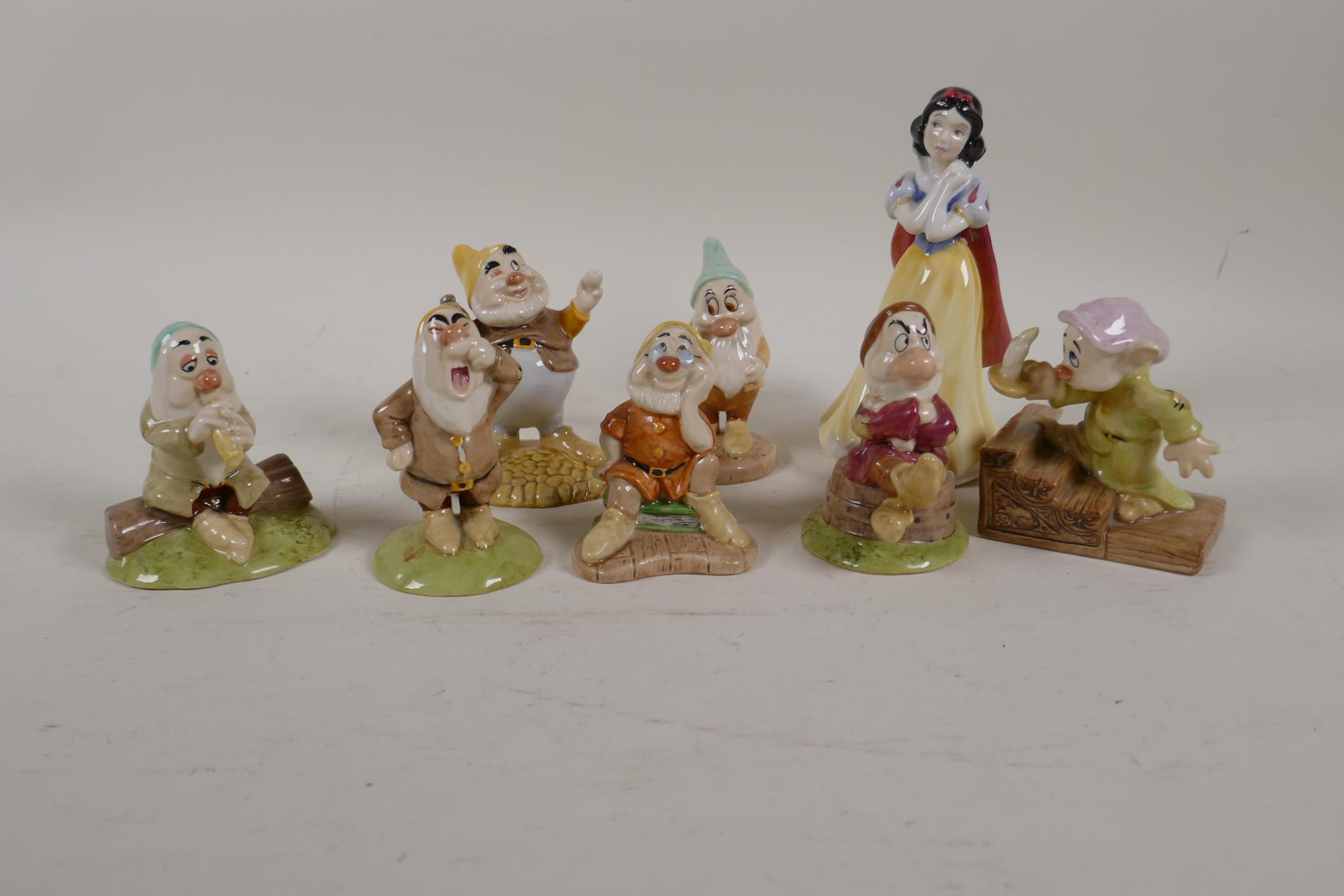 A Royal Doulton set of Snow White and the Seven Dwarfs