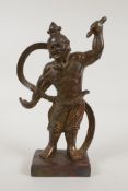 A Chinese gilt bronze of a deity with a flowing silk scarf, 10" high