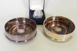 A pair of hallmarked silver wine bottle coasters with mahogany bases, Sheffield 1996, Carr's of