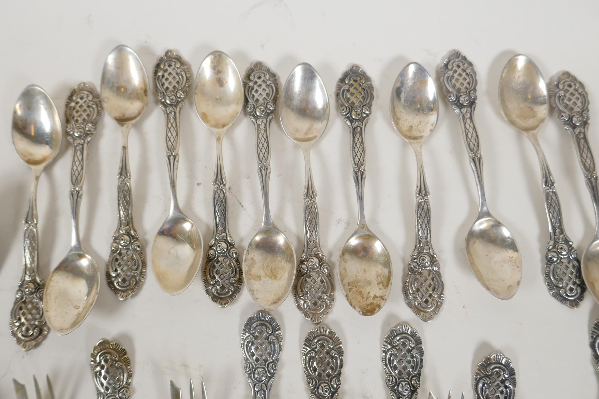 A set of twelve continental silver (800 mk) cake forks with pierced handles, and a set of twelve - Image 3 of 5