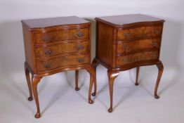 A pair of walnut serpentine bedside chests, raised on cabriole supports, 20" x 14", 30" high