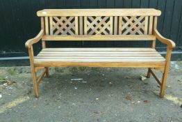 A teak garden bench, 55" long