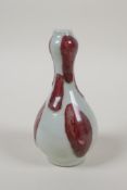 A Chinese red and white spot glazed porcelain spill vase, 5" high
