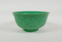 A green glazed porcelain rice bowl with raised dragon decoration, Chinese Yongzheng 6 character mark