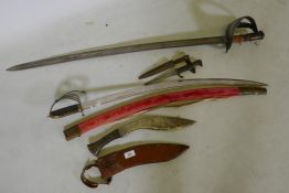 A 19th horn handled kukri with leather sheath, a C19th Italian cavalry sword, marked Hartkopf, an