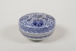 A Chinese blue and white porcelain box and cover with lotus flower decoration, 3½" diameter