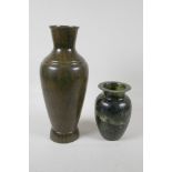A mottled green soapstone jar, 6½" high and a painted/glazed metal vase, with the appearance of