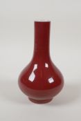 A Chinese sang de boeuf glazed porcelain bottle vase, 7" high