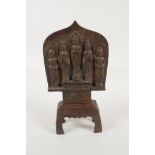 A Sino Tibetan bronze depicting five Buddist figures, 9" high