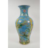 A turquoise and yellow ground porcelain vase with famille vert decoration of Chinese mythical