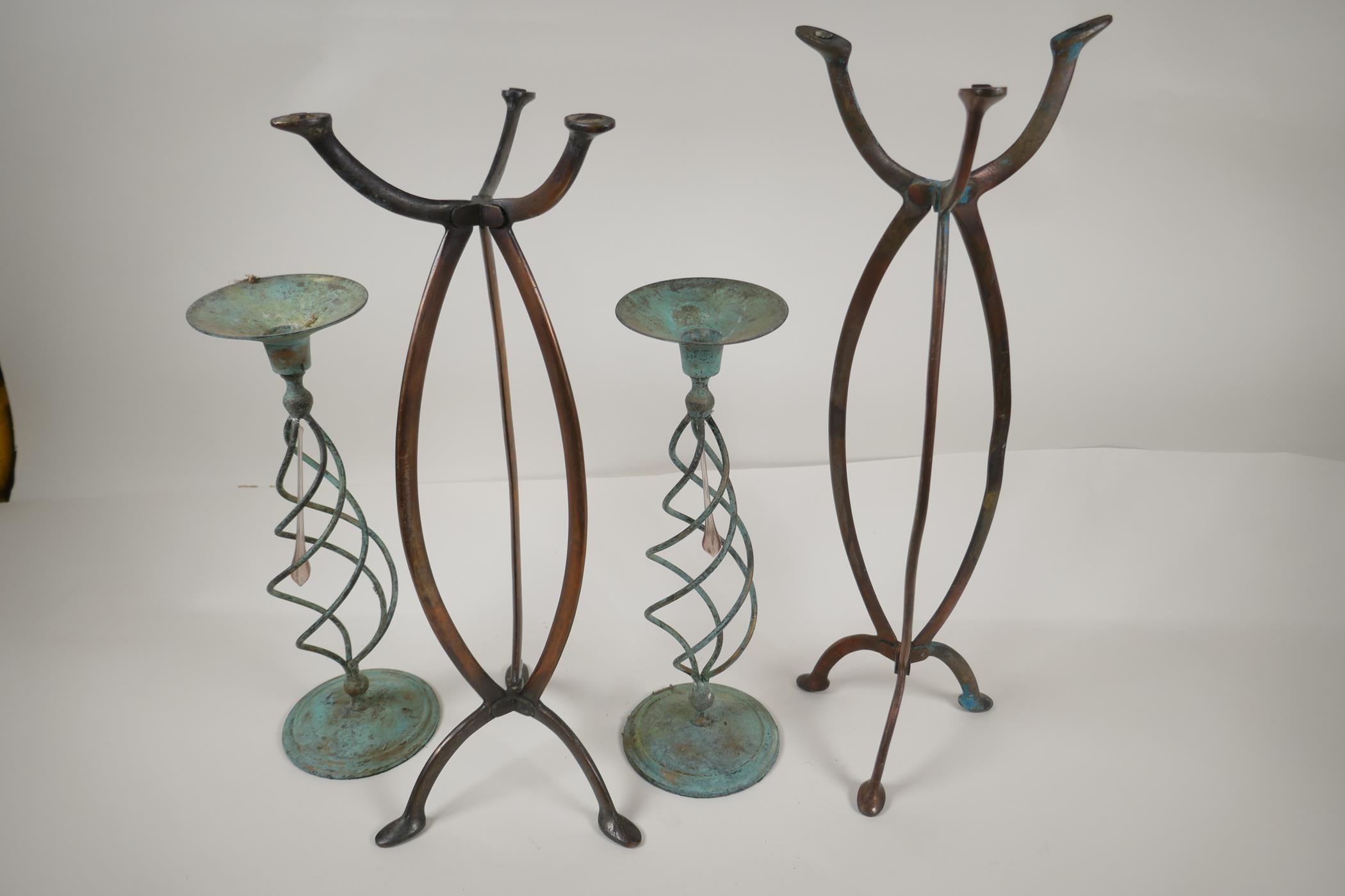 A pair of Art Nouveau bronze shop display stands from Harris and Sheldon, 18" high, and a pair of