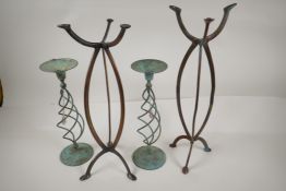 A pair of Art Nouveau bronze shop display stands from Harris and Sheldon, 18" high, and a pair of