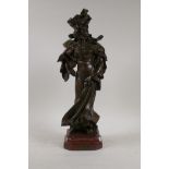 After A. Nelson, 'En Visite', Art Nouveau bronze figure of a woman, mounted on a rouge marble