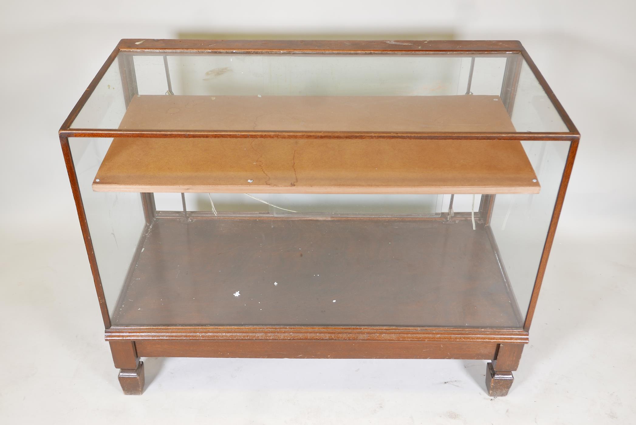 Antique mahogany glass top shop display cabinet, illuminated,  raised on square supports, with - Image 2 of 2