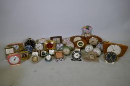 A quantity of vintage travel, alarm and mantel clocks