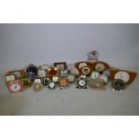 A quantity of vintage travel, alarm and mantel clocks