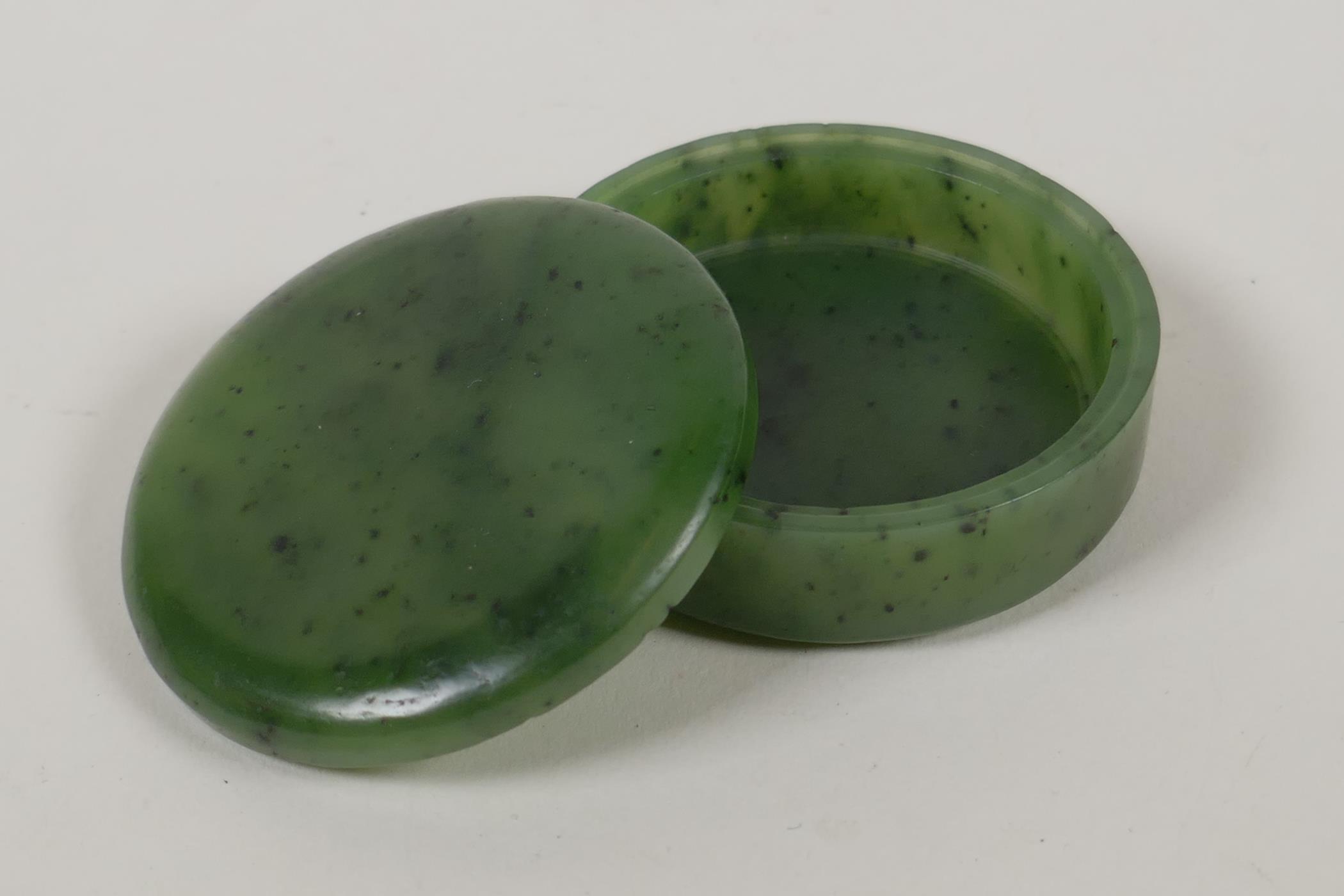 A mottled green jade ink box and cover, 2" diameter - Image 2 of 2