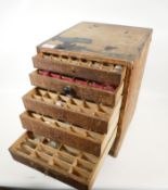 A quantity of watch and clock glasses, in a pine six drawer chest, chest 14" x 11" x 12"