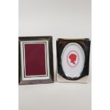 A hallmarked silver photo frame, aperture 7" x 5", and a contemporary silver plated photo frame