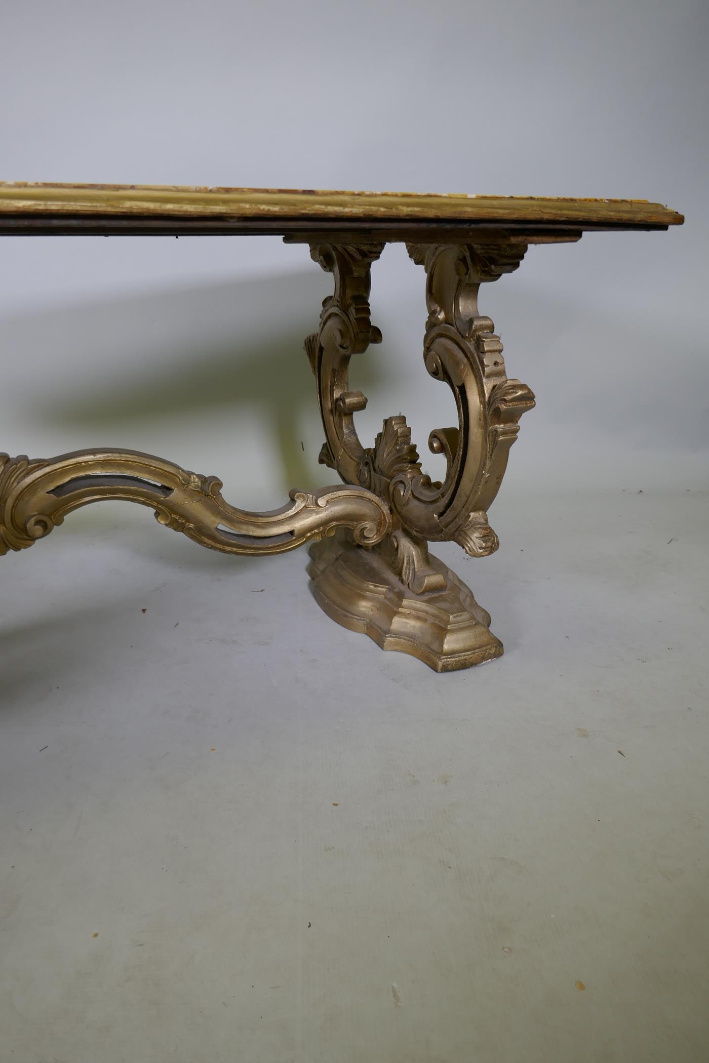 An Italian giltwood coffee table with Sienna marble top, raised on shaped and carved end supports, - Image 2 of 5