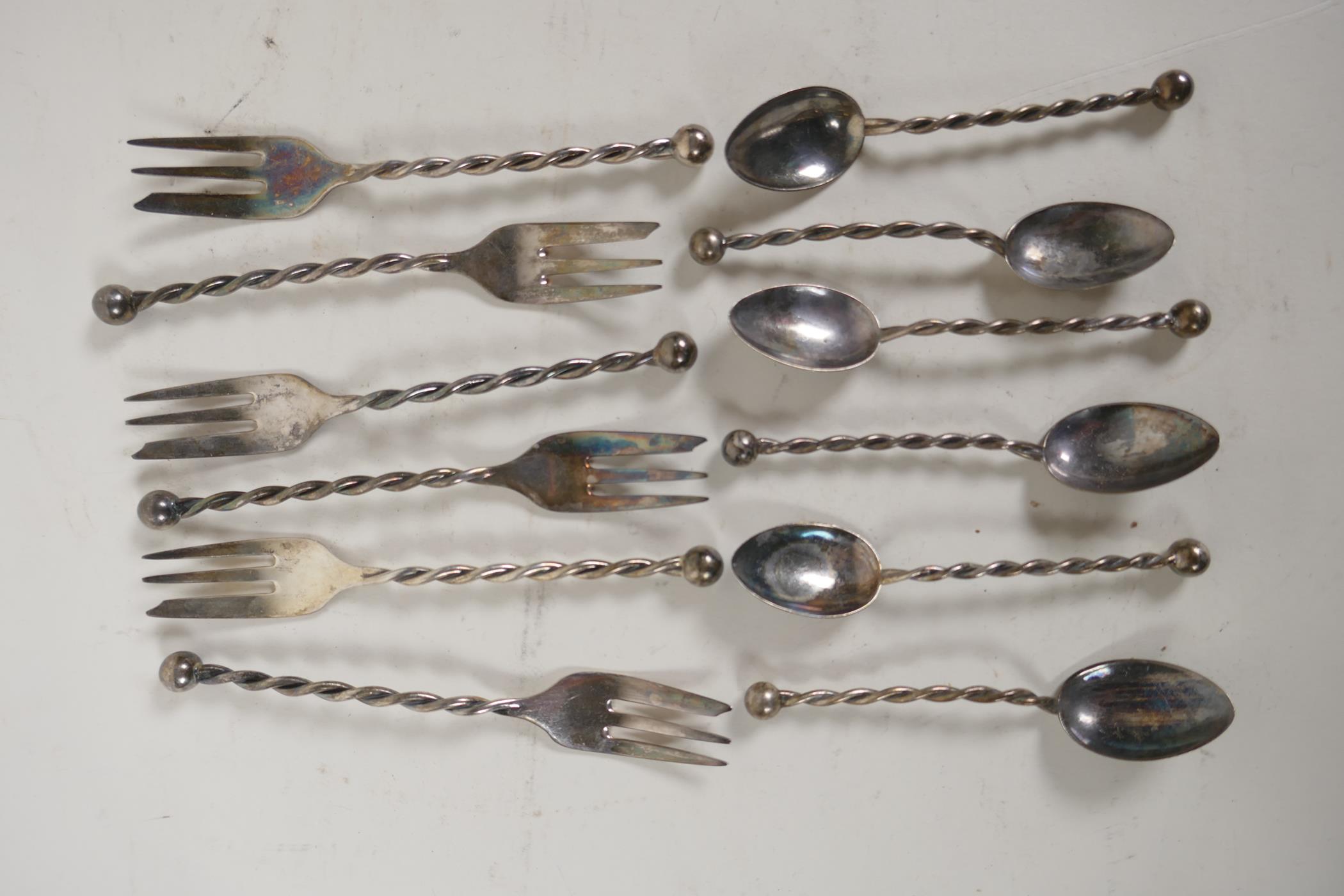 A set of six sterling silver cake forks with twist stems and  ball finials, and a matching set of