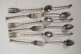 A set of six sterling silver cake forks with twist stems and  ball finials, and a matching set of