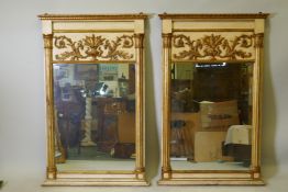 A pair of Italian painted and parcel gilt pier glass mirrors, with raised classical frieze and