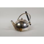 A Christopher Dresser style silver plated teapot, 5½" high