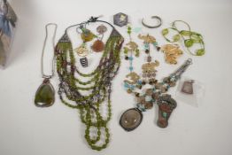 A quantity of Tibetan hardstone and white metal jewellery, pendants etc