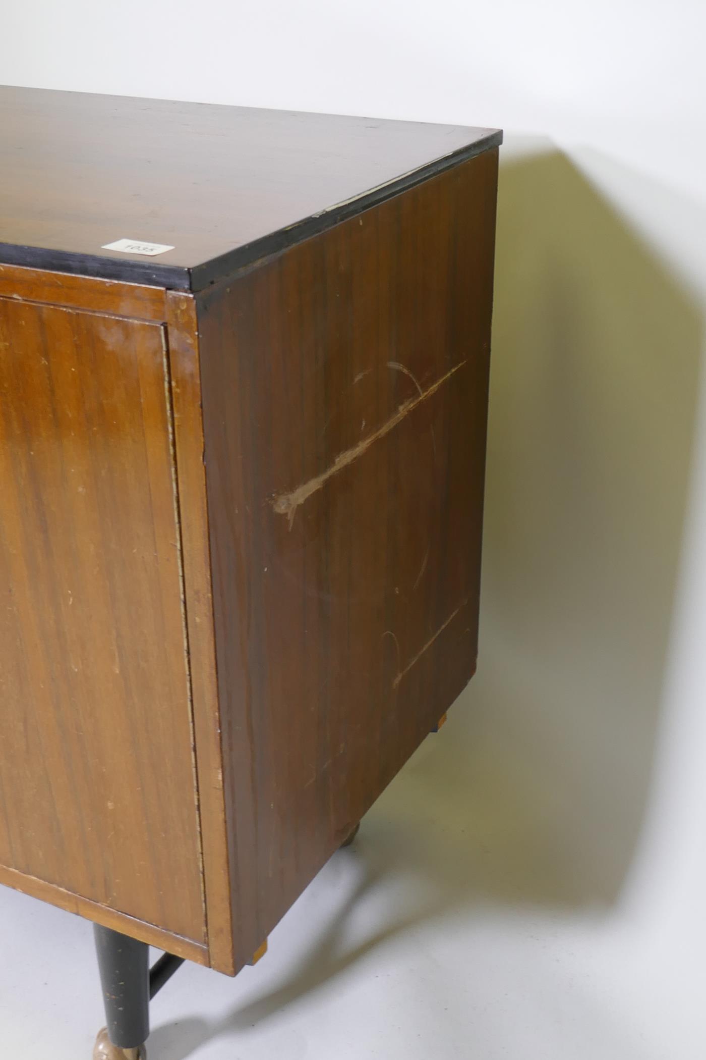A mid-century mahogany sideboard with ebonised detail, comprising two cupboards and four drawers, - Image 6 of 6