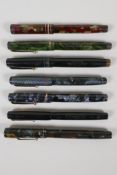 Seven 'Swan' Mabie Todd fountain pens, including three self-fillers, three leverless, and one minor,