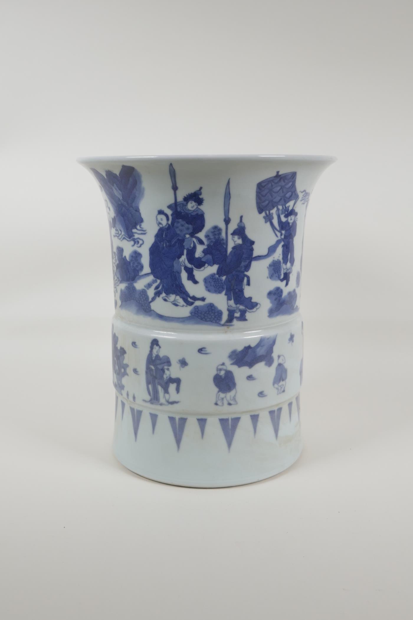 A Chinese blue and white porcelain gu shaped vase/brush pot, decorated with figures in landscape