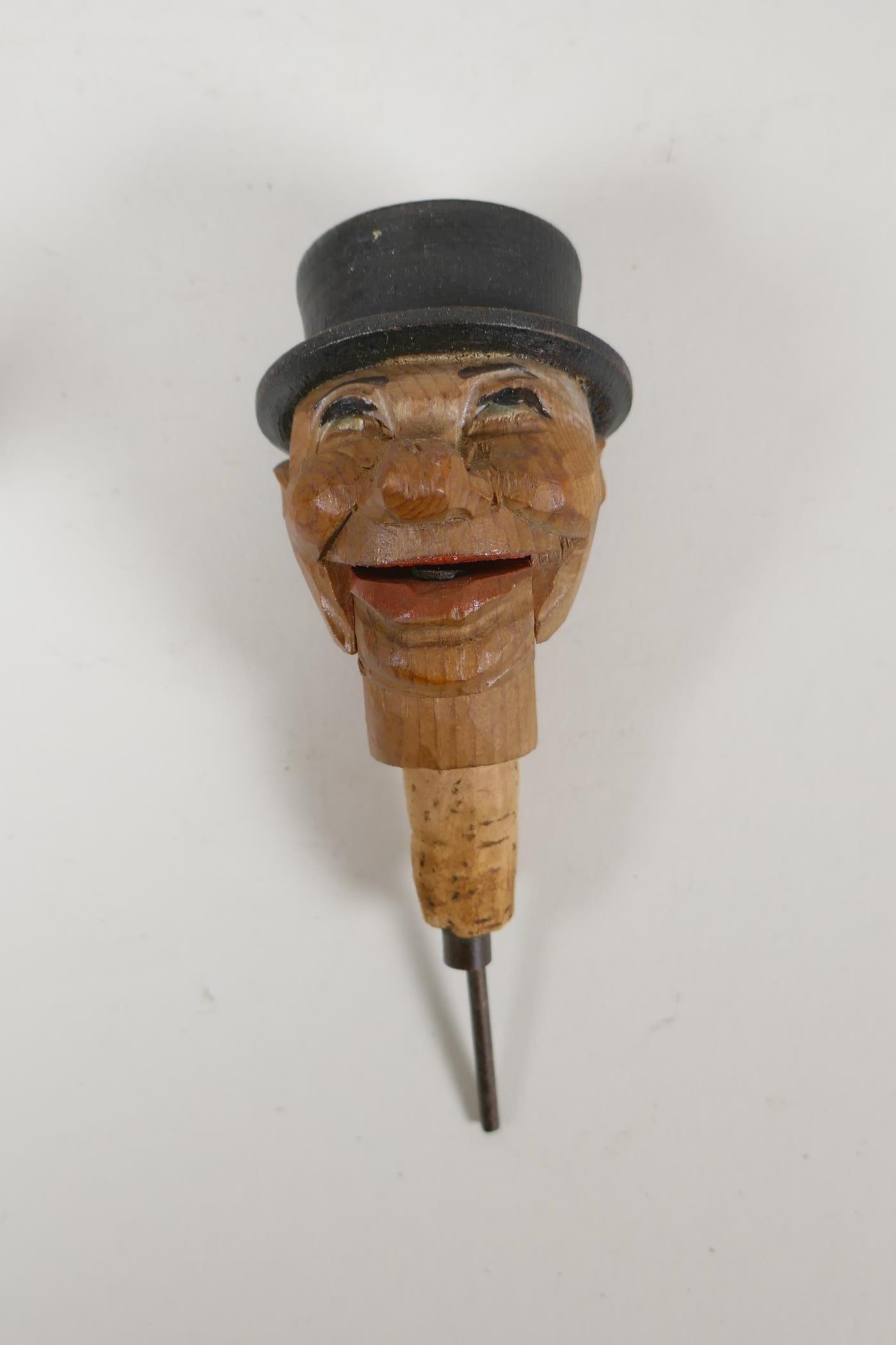 A set of four carved and painted Black Forest figural caricature bottle stoppers/pourers, in a - Image 5 of 7