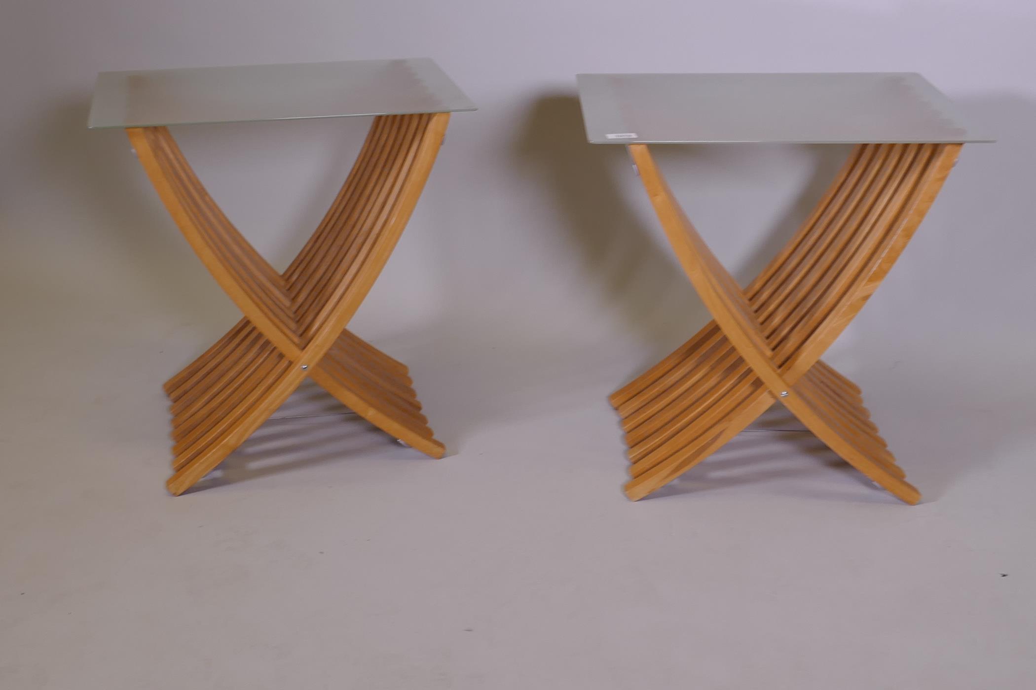 A pair of contemporary beechwood side tables with glass tops and folding bases, 16" x 21" x 21" - Image 2 of 2