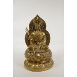 A Chinese polished brass figure of Buddha seated on a lotus throne, raised character to the reverse,