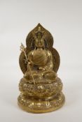 A Chinese polished brass figure of Buddha seated on a lotus throne, raised character to the reverse,