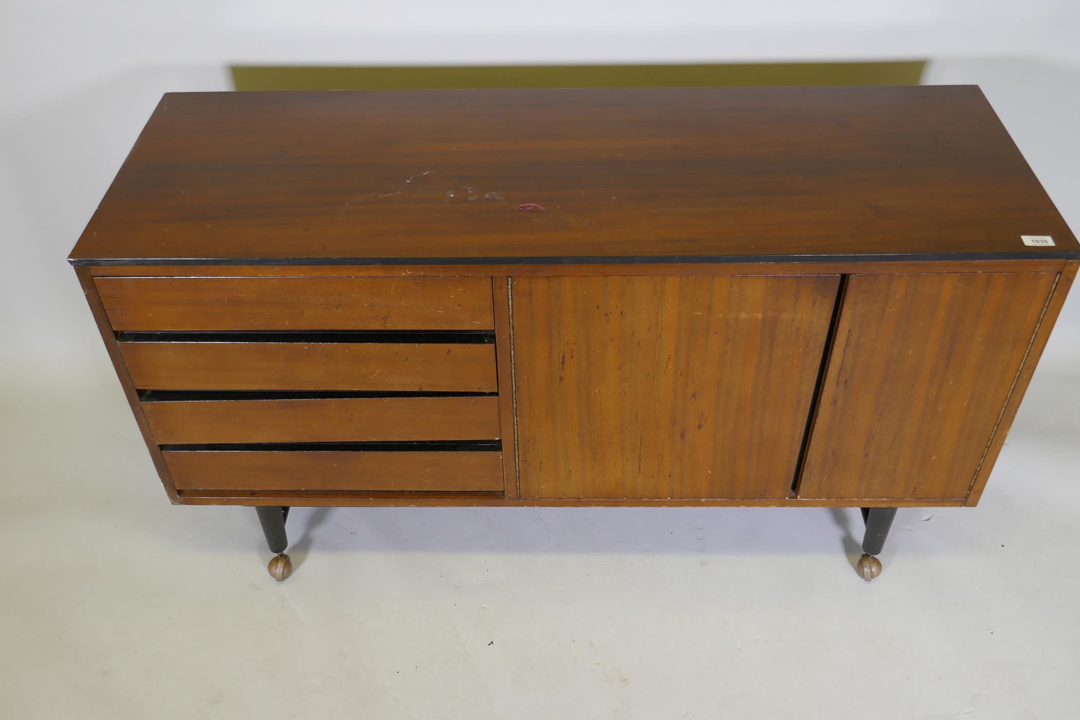 A mid-century mahogany sideboard with ebonised detail, comprising two cupboards and four drawers, - Image 3 of 6