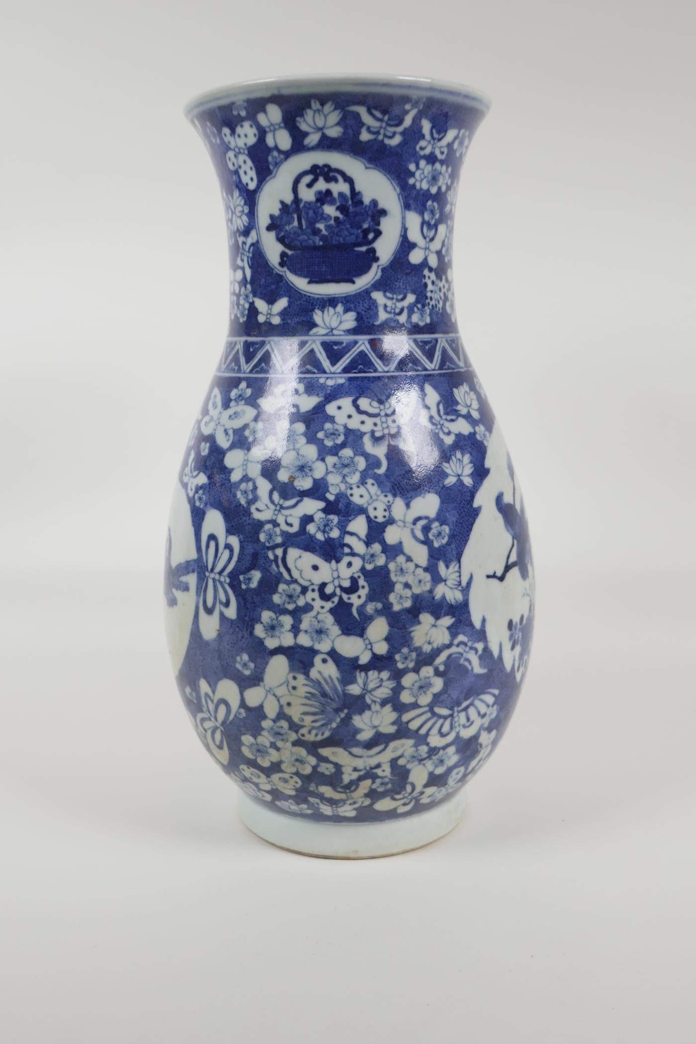 An early C20th Chinese blue and white porcelain vase with two decorative panels depicting birds - Image 2 of 5