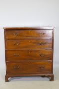 A C19th mahogany chest of four long drawers, with boxwood stringing, cockbeaded detail and brass