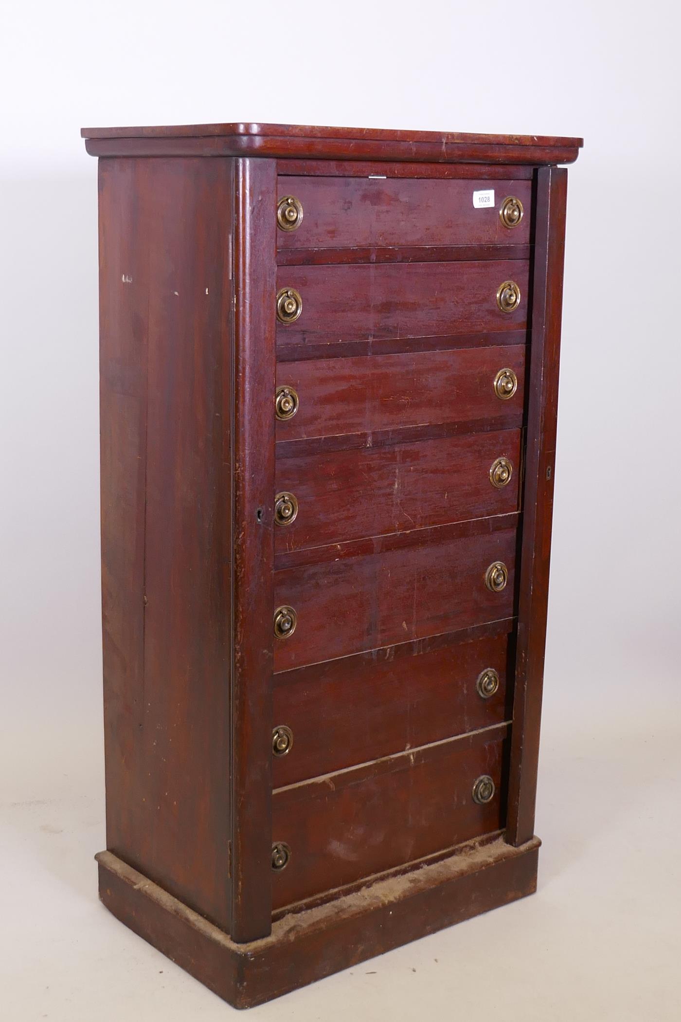 A C19th mahogany seven drawer Wellington chest, with brass ring handles, raised on a plinth base,