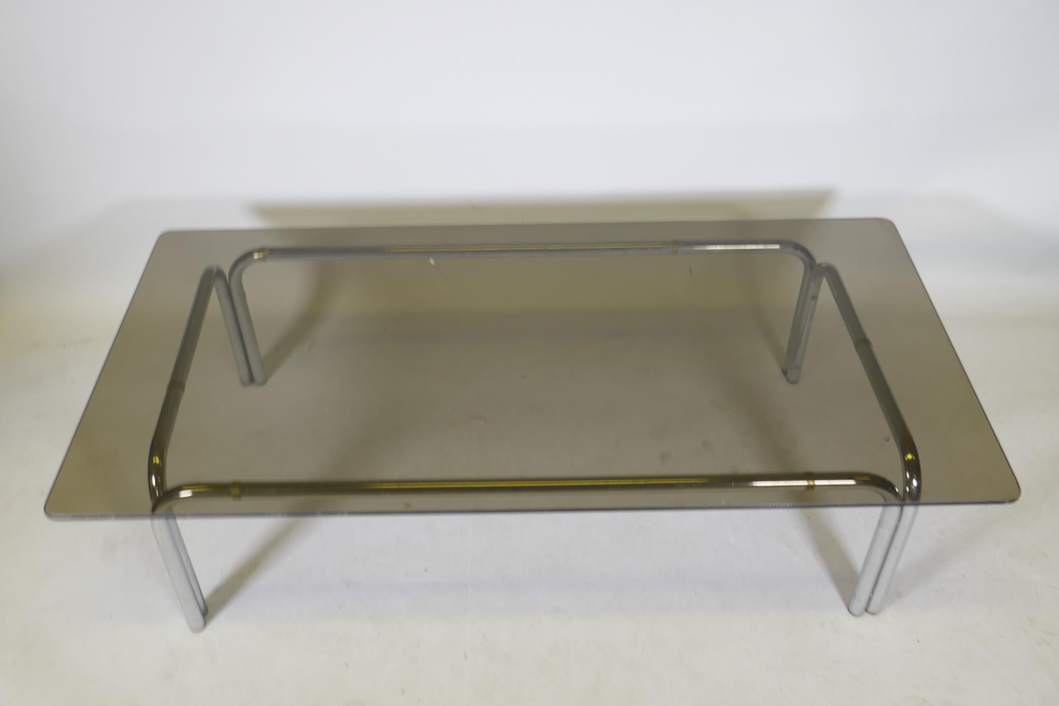 A chromed metal and smoked glass contemporary coffee table, 59" x 29", 15" high - Image 2 of 2