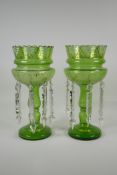 A pair of Bohemian green glass lustres, with gilt & enamel decoration, 1 drop missing, AF, 13½" high