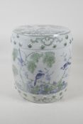 A Chinese pottery barrel stool/garden seat, with green & blue decoration of birds perched in