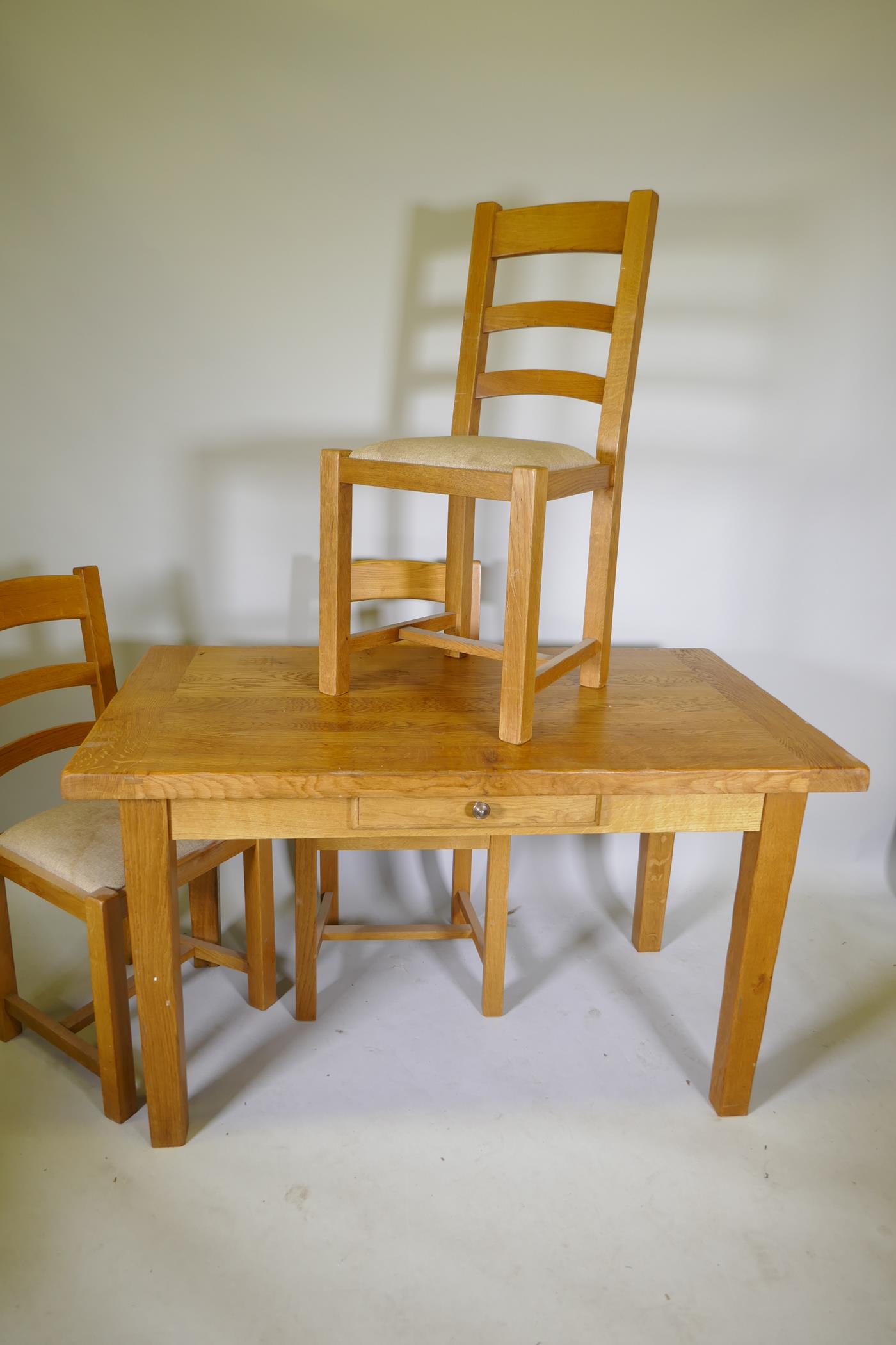 A blond oak kitchen table with single drawer and three matching ladder back dining chairs, 51½" x - Image 2 of 3