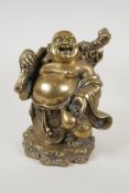 A Chinese filled and polished bronze figure of a jolly Buddha, 10½" high
