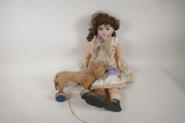 A C19th German doll with bisque head, composition limbs, four teeth and sleeping eyes, 19" tall, A/